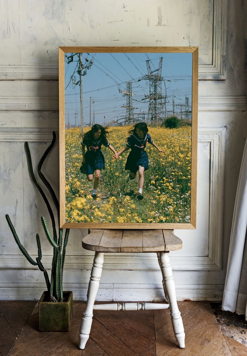 Girls Running Through Wildflowers Poster. room preview