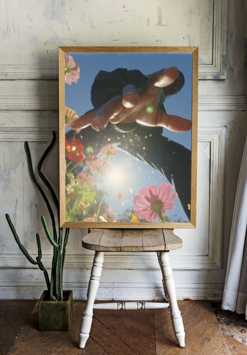 Sunlit Flowers and Hand Photography Poster. room preview