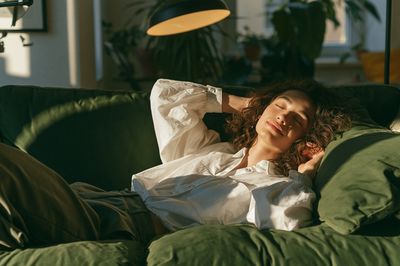 Relaxed Woman on Sofa Photography Poster. poster