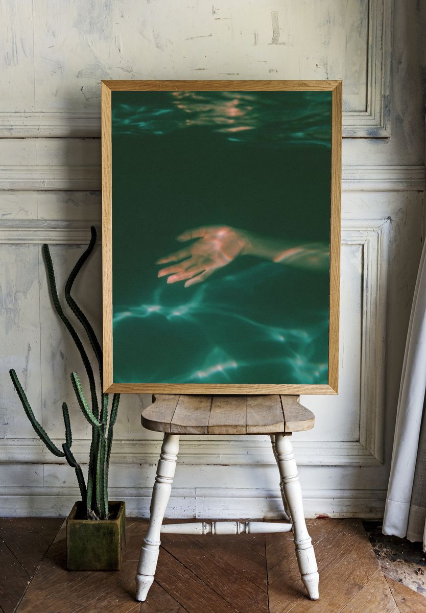 Submerged Hand Photography Poster. room preview