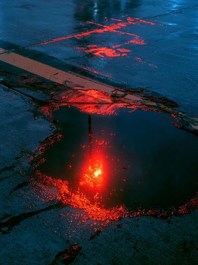 Neon Rain Puddle Photography Poster. poster
