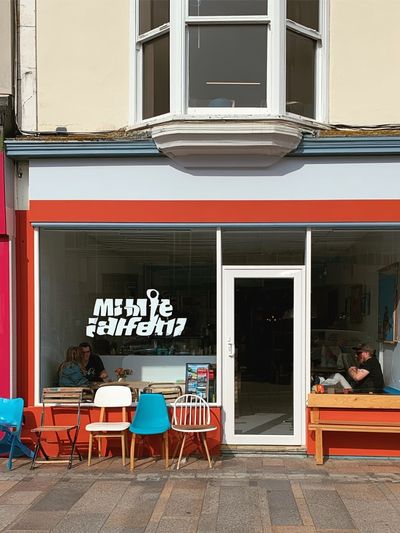 Colorful Cafe Facade Photography Poster. poster