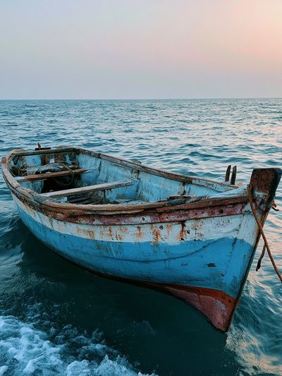 Weathered Boat at Sea Photography Poster.