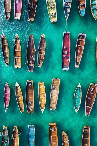 Colorful Boats Over Turquoise Water Poster.