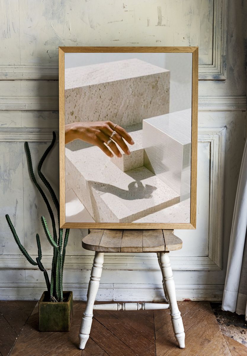 Hand and Stone Blocks Photography Poster. — room view 1