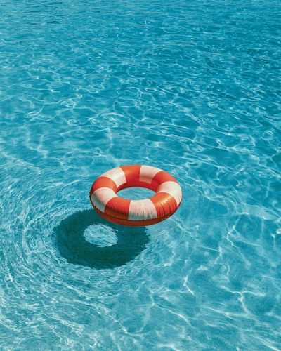 Lifebuoy in Blue Water Photography Poster. poster