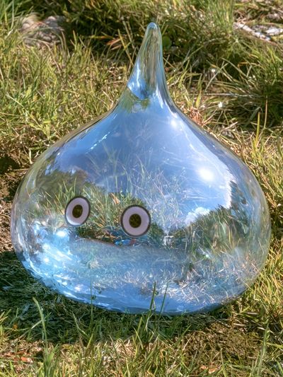Glass Slime in Grass Photography Poster. poster