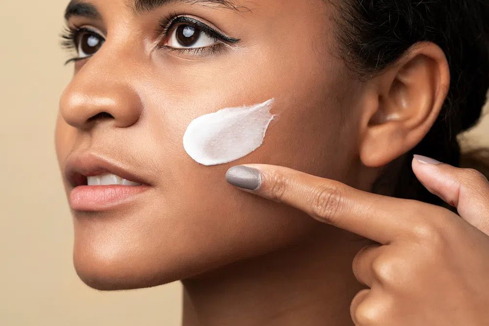Closeup beautiful woman using moisturizing. poster detail