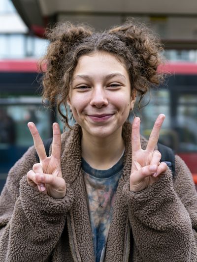 Smiling Girl Peace Sign Portrait Print.
