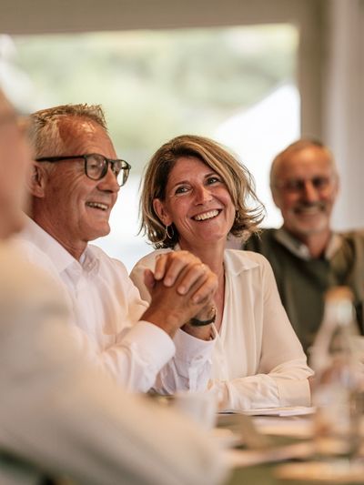 Smiling Friends at Dinner Photography Poster.