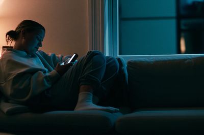 Cozy Evening Phone Glow Photography Poster.