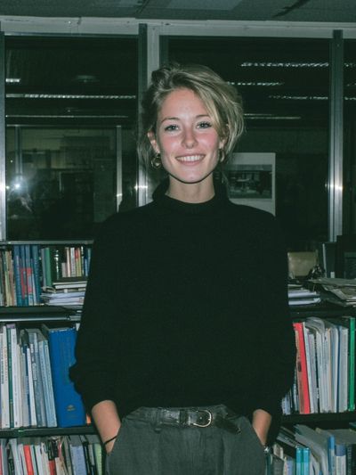 Smiling Woman in Library Photography Poster.