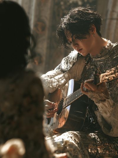 Guitarist in Silver Armor Poster.