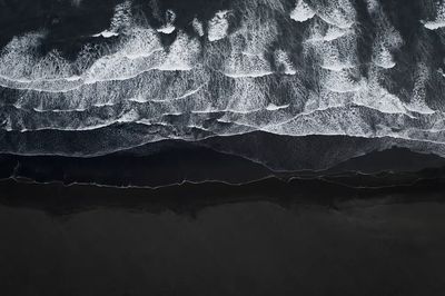 Aerial view black sand beach.
