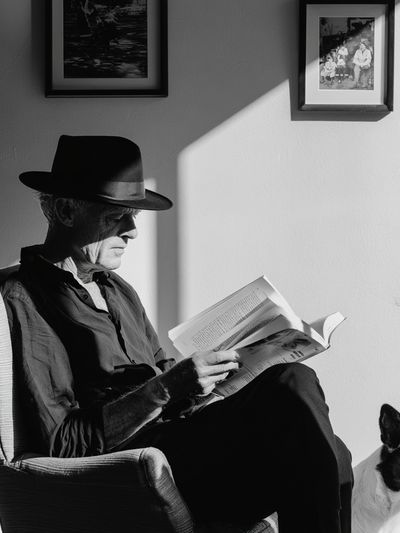 Man Reading with Dog Black-White Poster.