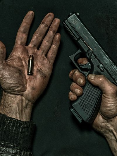 Bullet and Hand Photography Poster.
