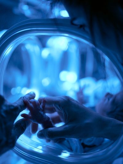 Newborn Hand in Incubator Photography Poster. poster print