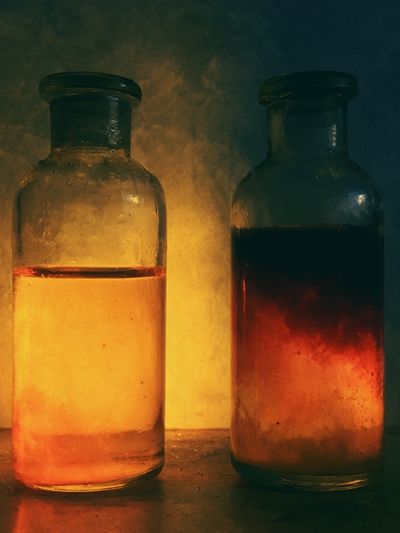 Glowing Glass Bottles Photography Poster.