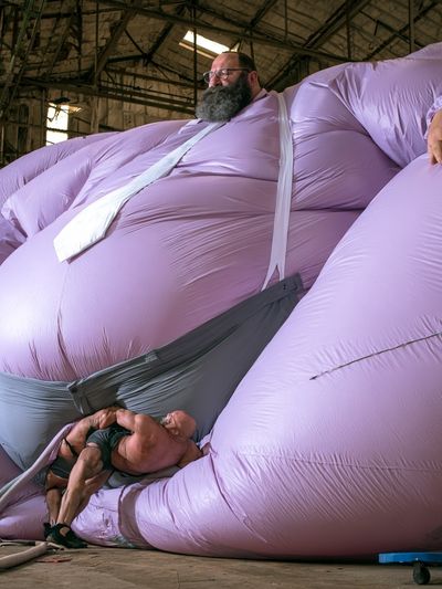 Inflatable Giant Figure Photography Poster.