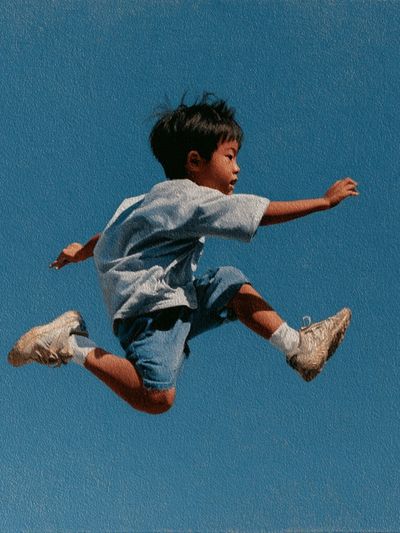 Boy Jumping Blue Sky Poster.