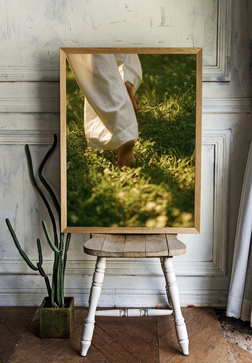 Barefoot Walk in Sunlit Grass Photography Poster. room preview