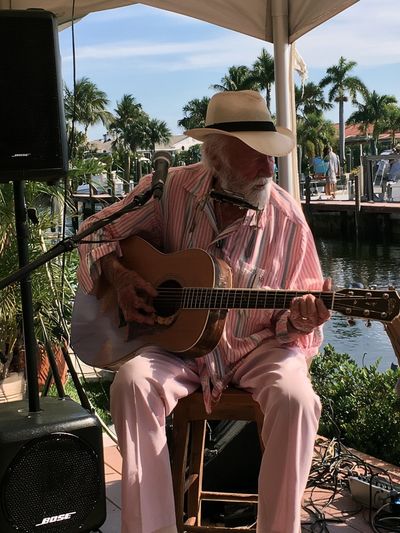 Harbor Guitarist Photography Poster.