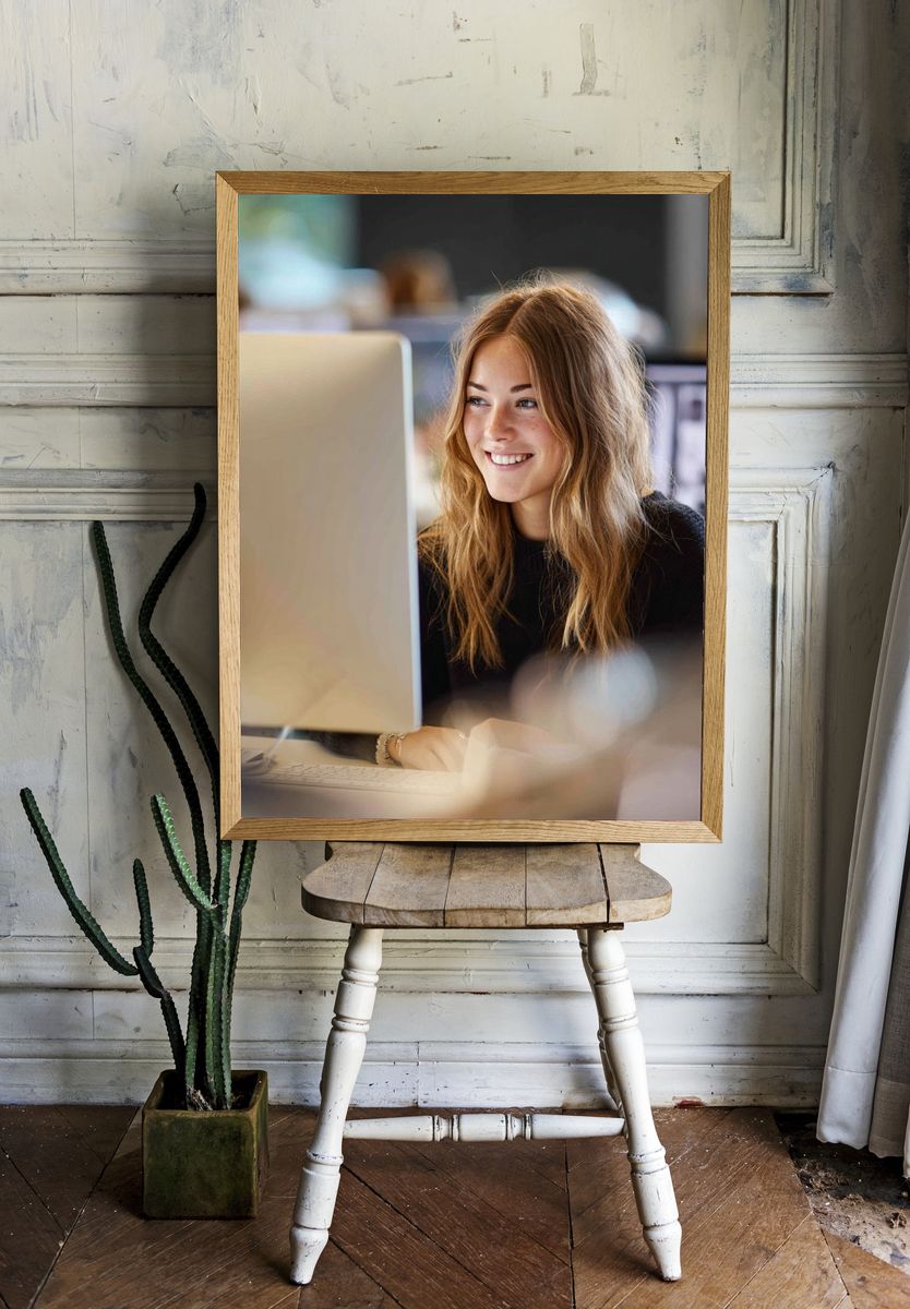 Smiling Woman at Desk Photography Poster. room preview