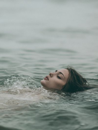Floating Woman in Sea Photography Print. poster