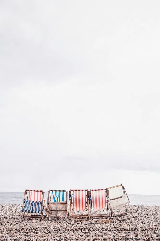 Colored striped beach chairs beach. poster — photography art