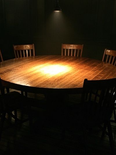 Dimly Lit Round Table Photography Poster. poster
