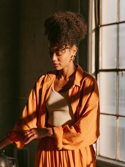 Sunlit Portrait in Orange Poster.