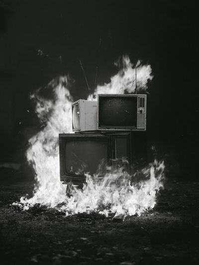 Burning TVs Black-White Poster.