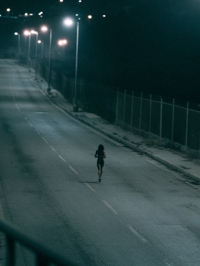 Night Runner Street Photography Poster. poster