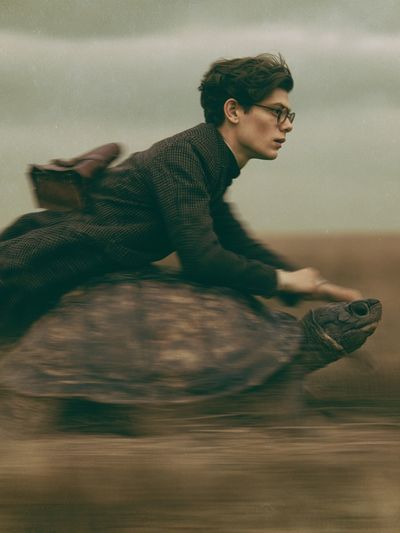 Boy Riding Turtle Photography Print.