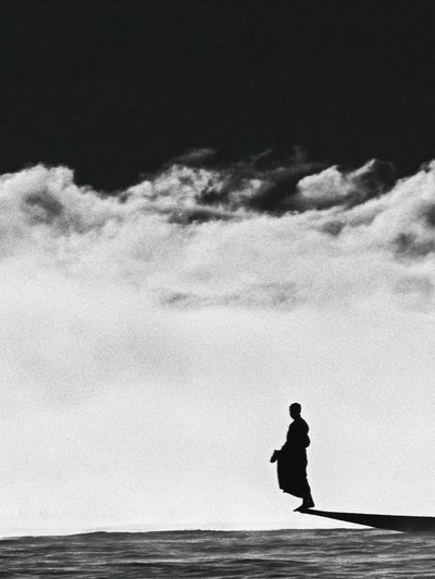 Solitary Figure in Clouds Photography Poster. poster