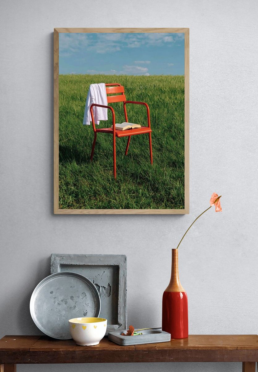 Red Chair in Meadow Photography Poster. — room view 3