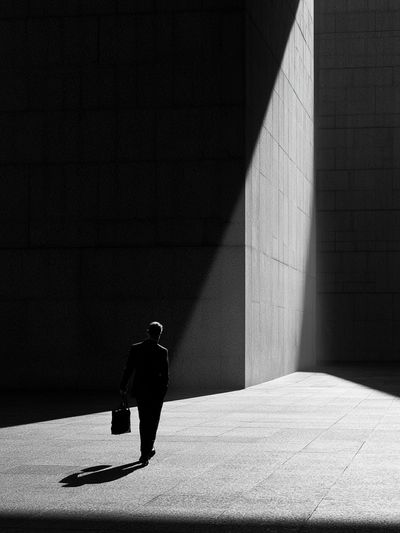 Solitary Figure in Light Poster.