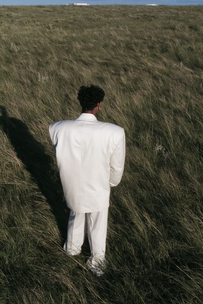 Solitary Figure in Grass Photography Poster.