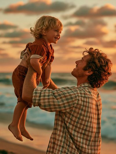 Sunset Beach Father and Child Poster. poster