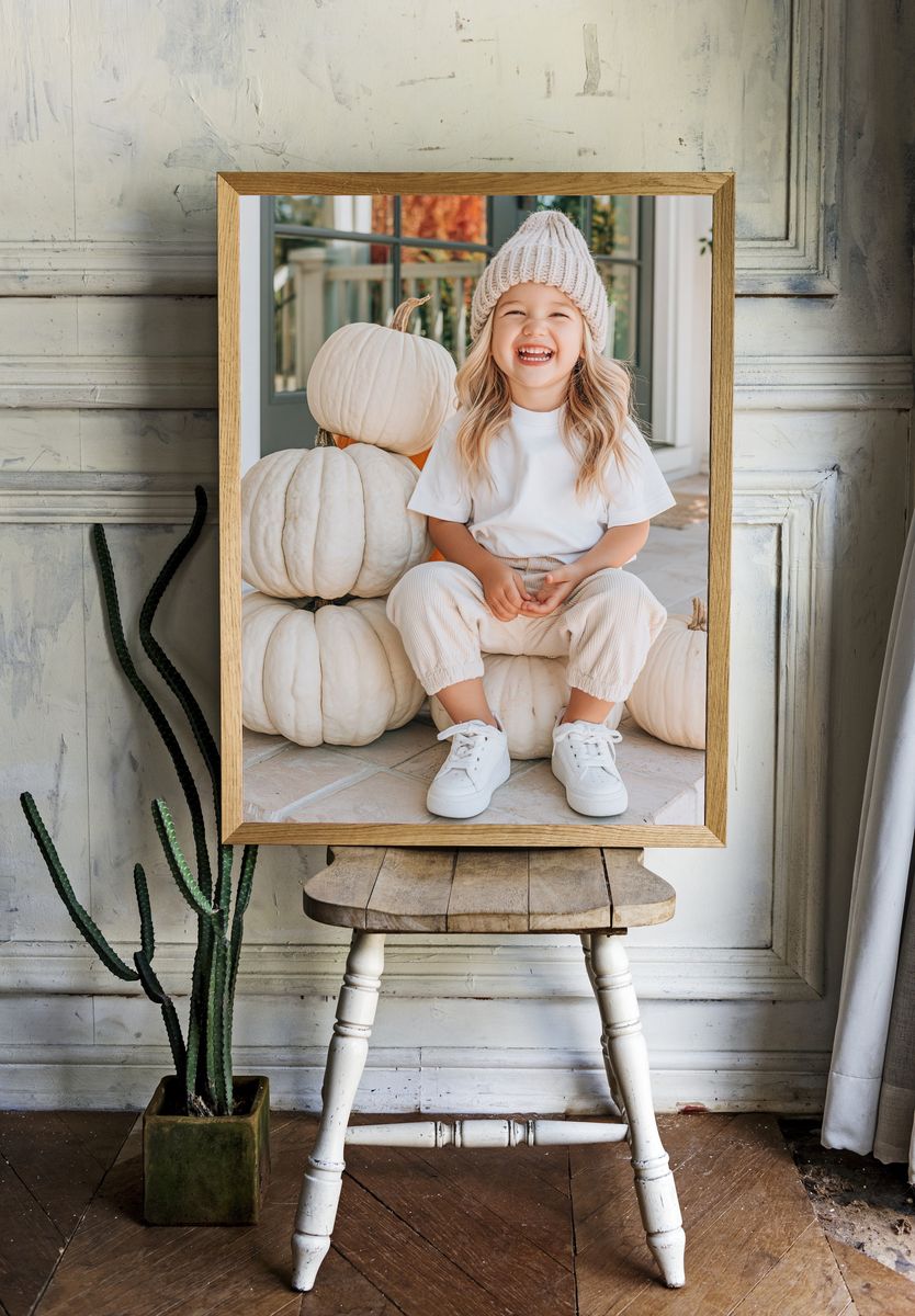 Smiling Child with Pumpkins Photography Poster. — room view 1