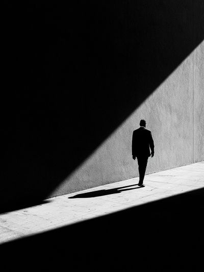 Solitary Figure in Light Poster. poster