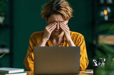 Stressed Woman at Laptop Photography Poster.