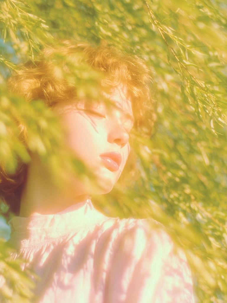 Sunlit Portrait in Green Foliage Poster. poster detail