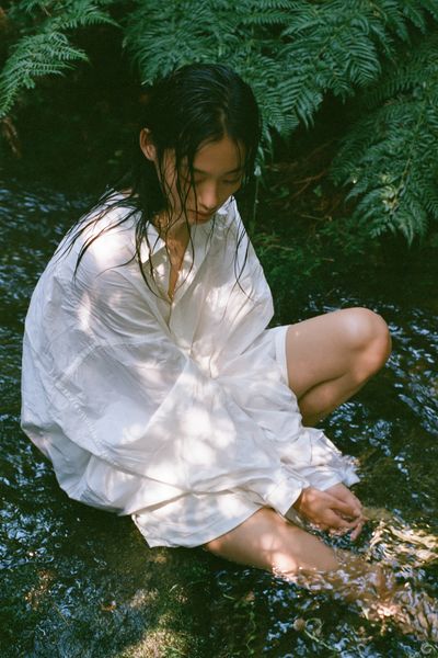 Serene Woman in Forest Stream Poster.