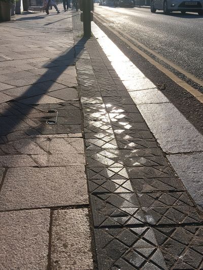 Sunlit Sidewalk Street Photography Poster. poster
