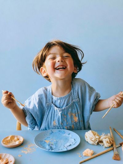 Joyful Child Painting Portrait Poster.