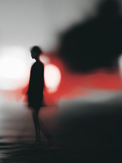 Blurred Figure in Red Light Poster.