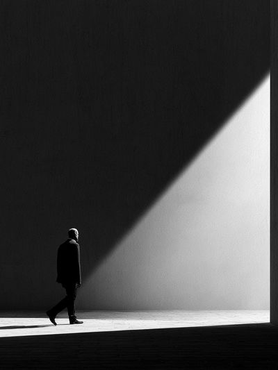 Solitary Figure in Light Poster.