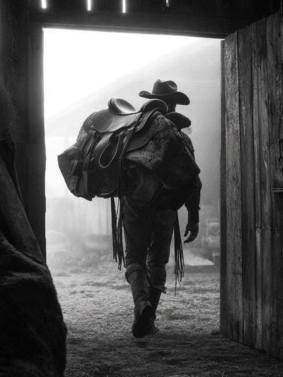 Cowboy in Barn Doorway Black-White Poster. poster