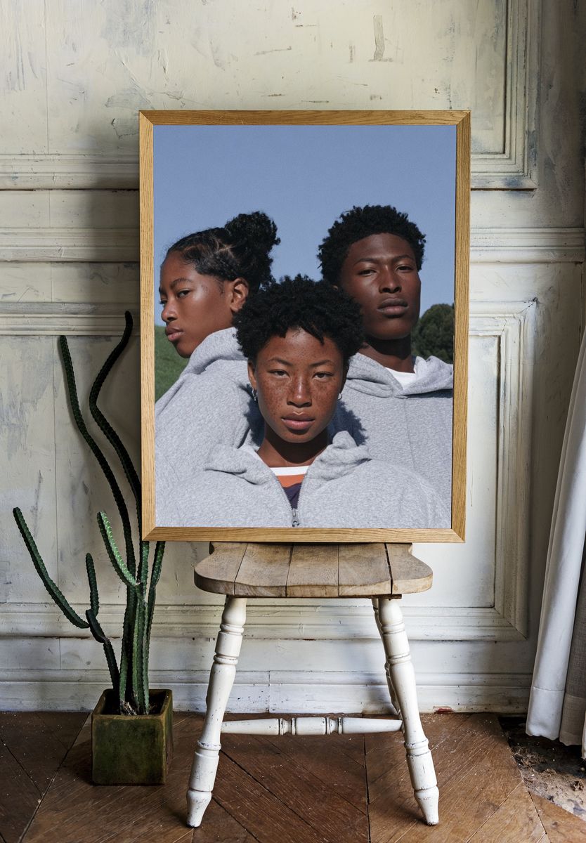 Three Portraits in Grey Hoodie Poster. room preview